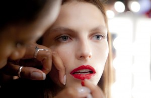 Girl applying makeup