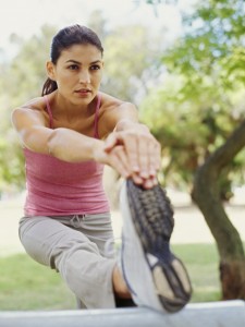 young woman exercising in a park